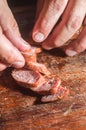 Sliced Ã¢â¬â¹Ã¢â¬â¹smoked calabrese sausage in a wooden table,copy space